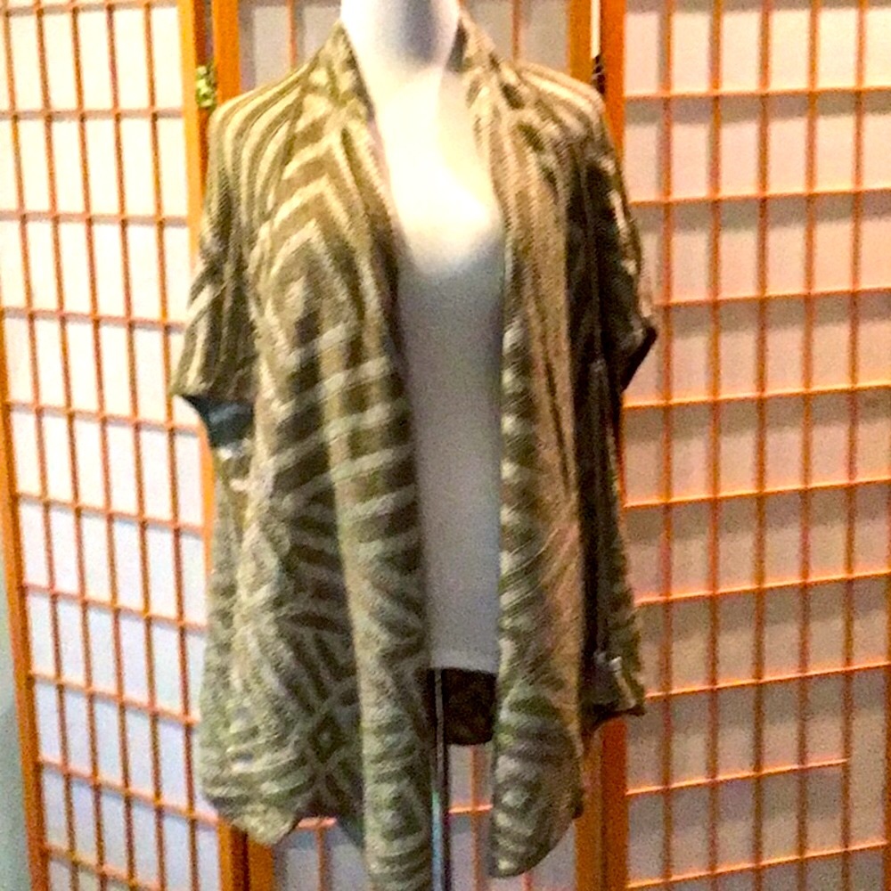Calypso  ,wrap /sweater , fits Small to Extra large , hardly worn .